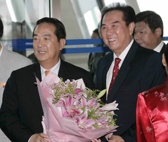 Chen Yunlin (R), director of the Taiwan Work Office of the Communist Party of China (CPC) Central Committee, greets James Soong, Chairman of the People First Party (PFP) in Taiwan, upon his arrival at Pudong airport of Shanghai, Sept. 14, 2005. Soong left Taipei for the Chinese mainland city Shanghai Wednesday morning to attend the first session of a non-governmental forum of elites from both sides of the Taiwan Strait.1