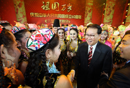 Li Changchun, member of the Standing Committee of the Communist Party of China (CPC) Central Committee Political Bureau Tuesday watched a large-scale art performance to mark the 60th founding anniversary of the People's Republic.